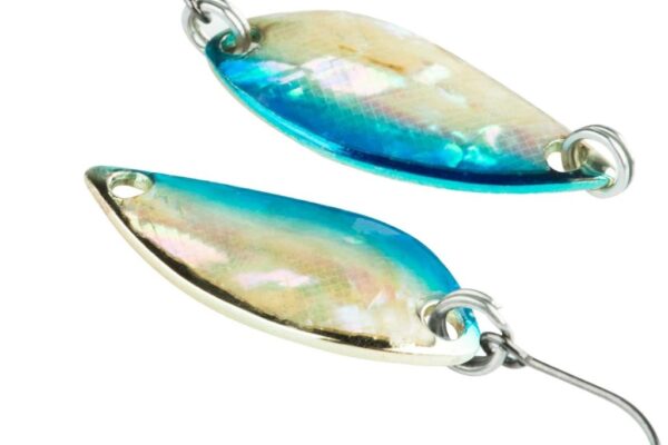 Close-up of a shiny fishing spoon lure glinting in sunlight, ready for casting, highlighting why Canadian anglers prefer this type of lure