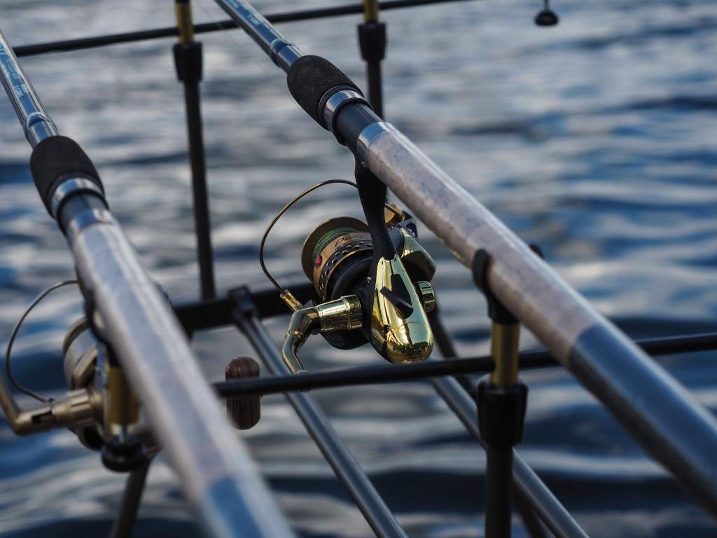 Deep sea fishing rod under tension during ocean jigging