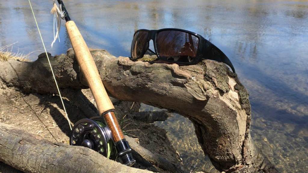 Fisherman using blue mirror sunglasses in bright ocean conditions