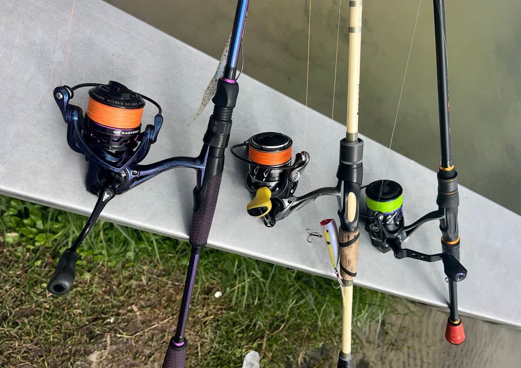 Angler holding rod and reel combo while preparing to cast into freshwater river