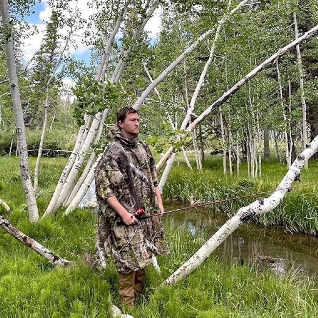 AUSCAMOTEK camouflage hooded rain poncho designed for hunting, camping, and fishing in wet conditions