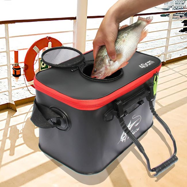 Collapsible fishing bucket storing live bait and fish beside a lakeshore in Michigan